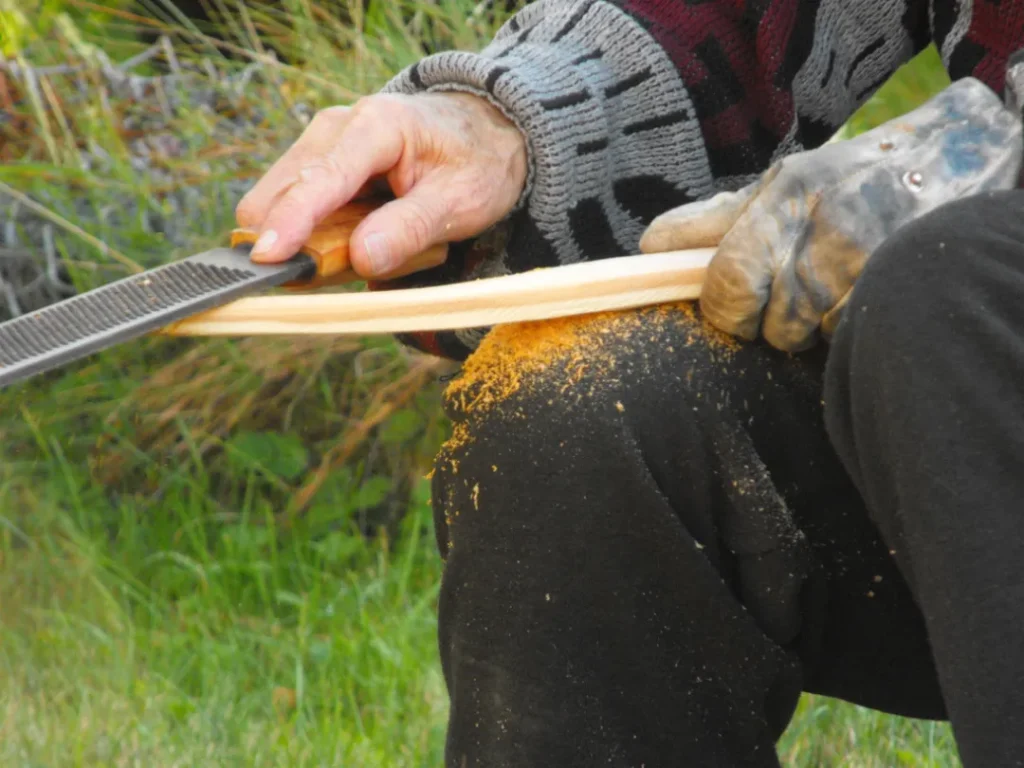 A student making a bow at a Ravenbeak Natureworks workshop | ravenbeak.com