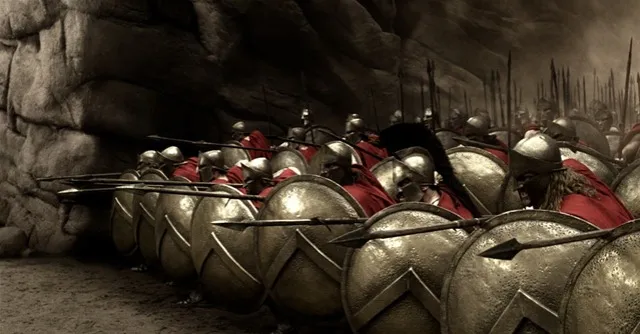 Group of Spartan warriors form a shield wall