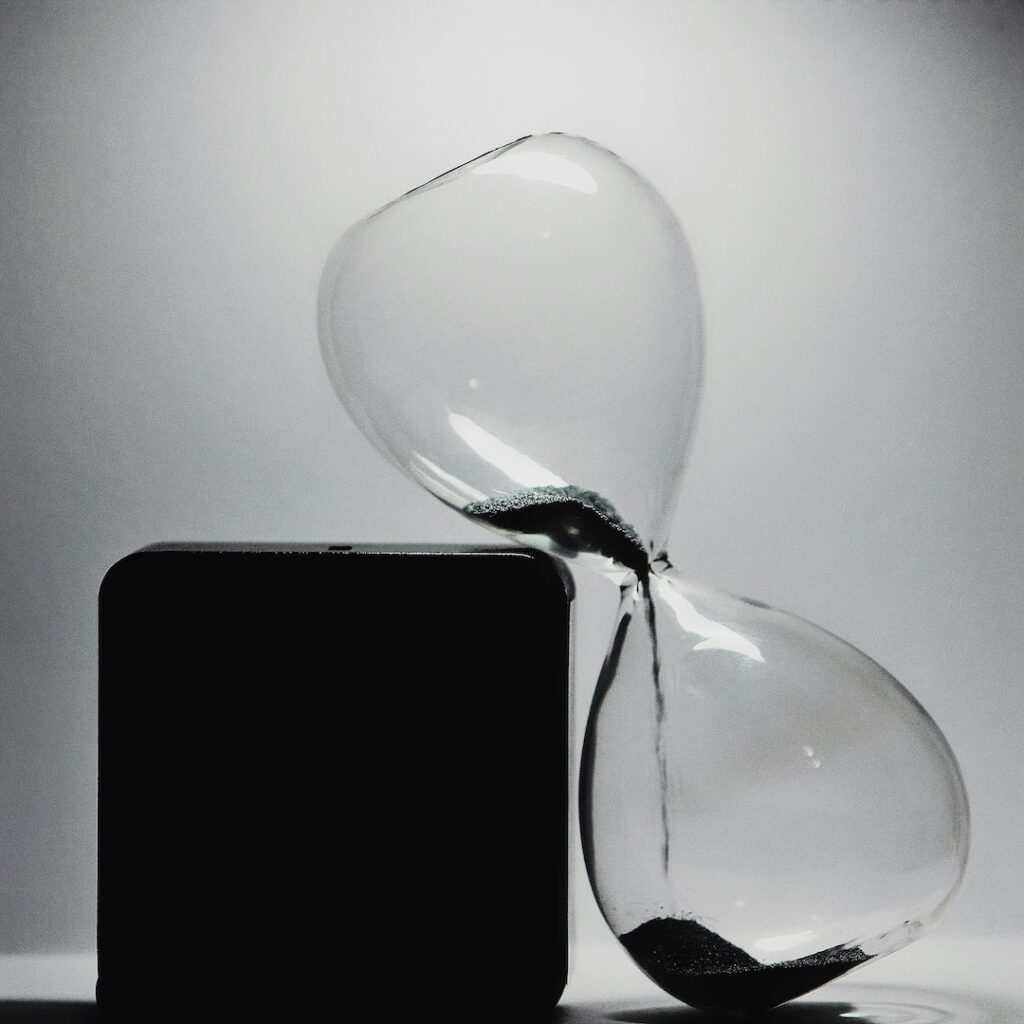 Leaning hour glass