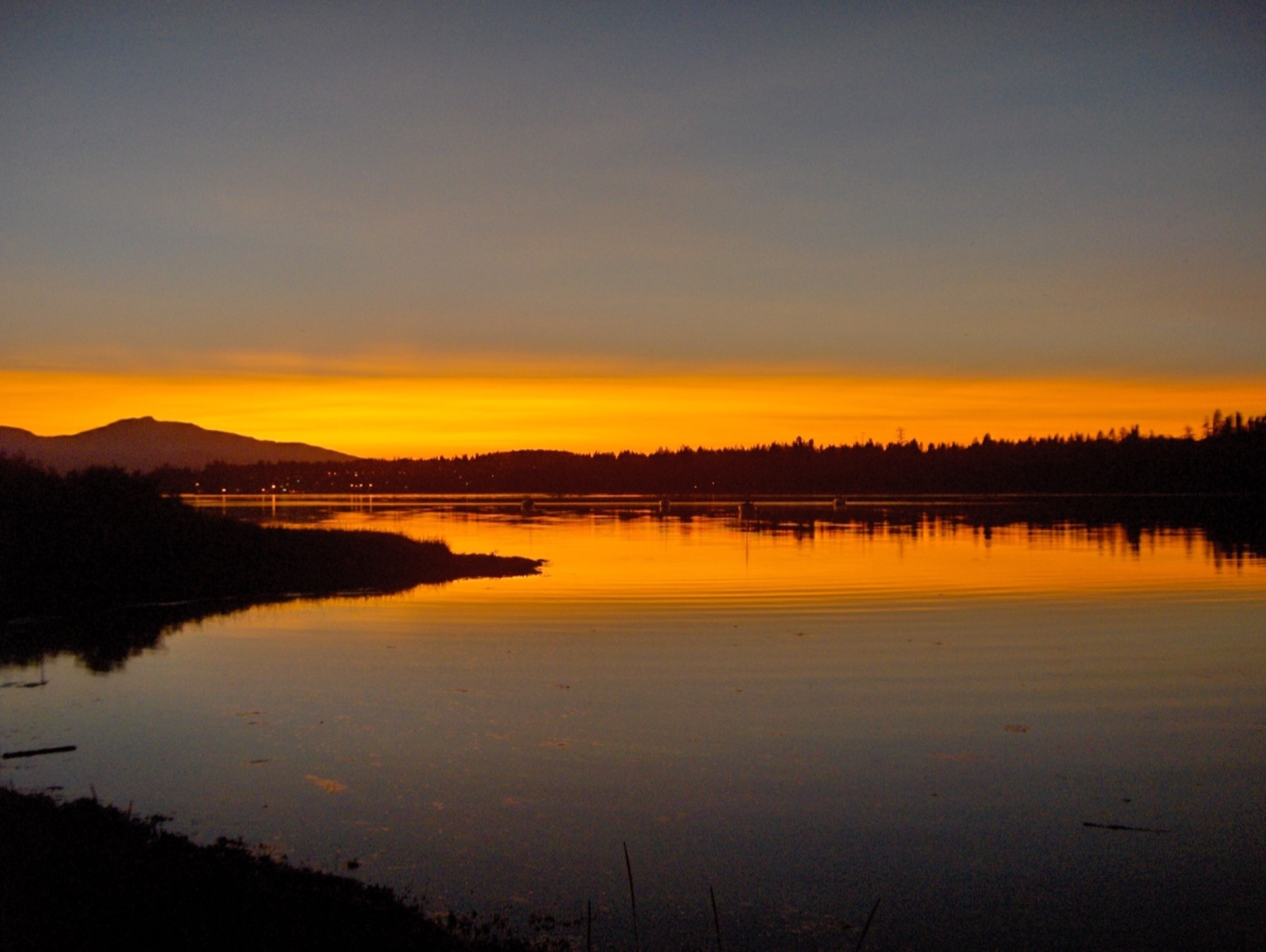 Sunset over the Comox Lagoon by Ray St. Denis